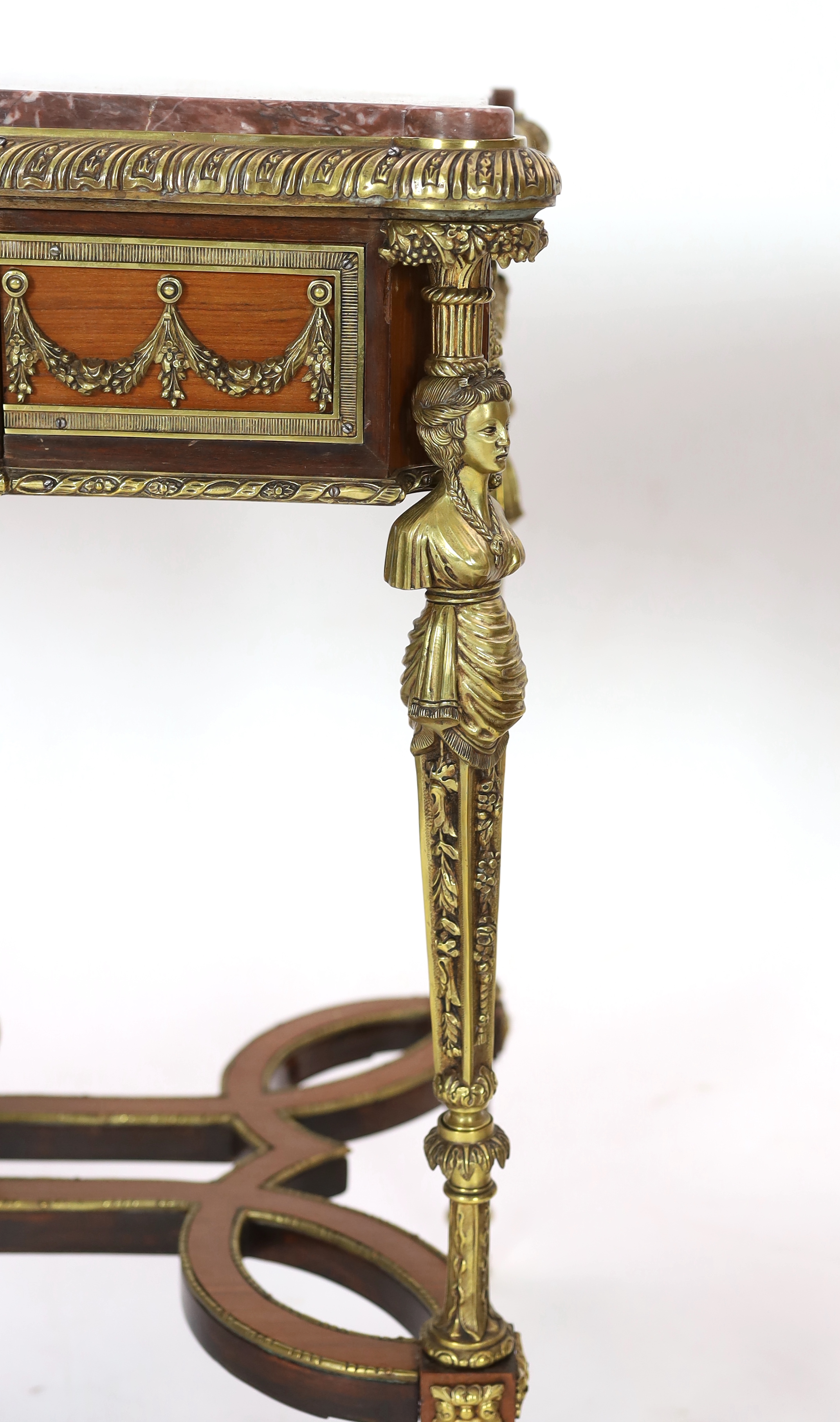 A pair of Louis XVI style ormolu mounted centre tables, 85cm wide, 51cm deep, 79cm high